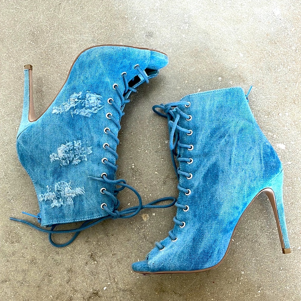 Distressed denim High Heel booties. Street style for the fashionista.